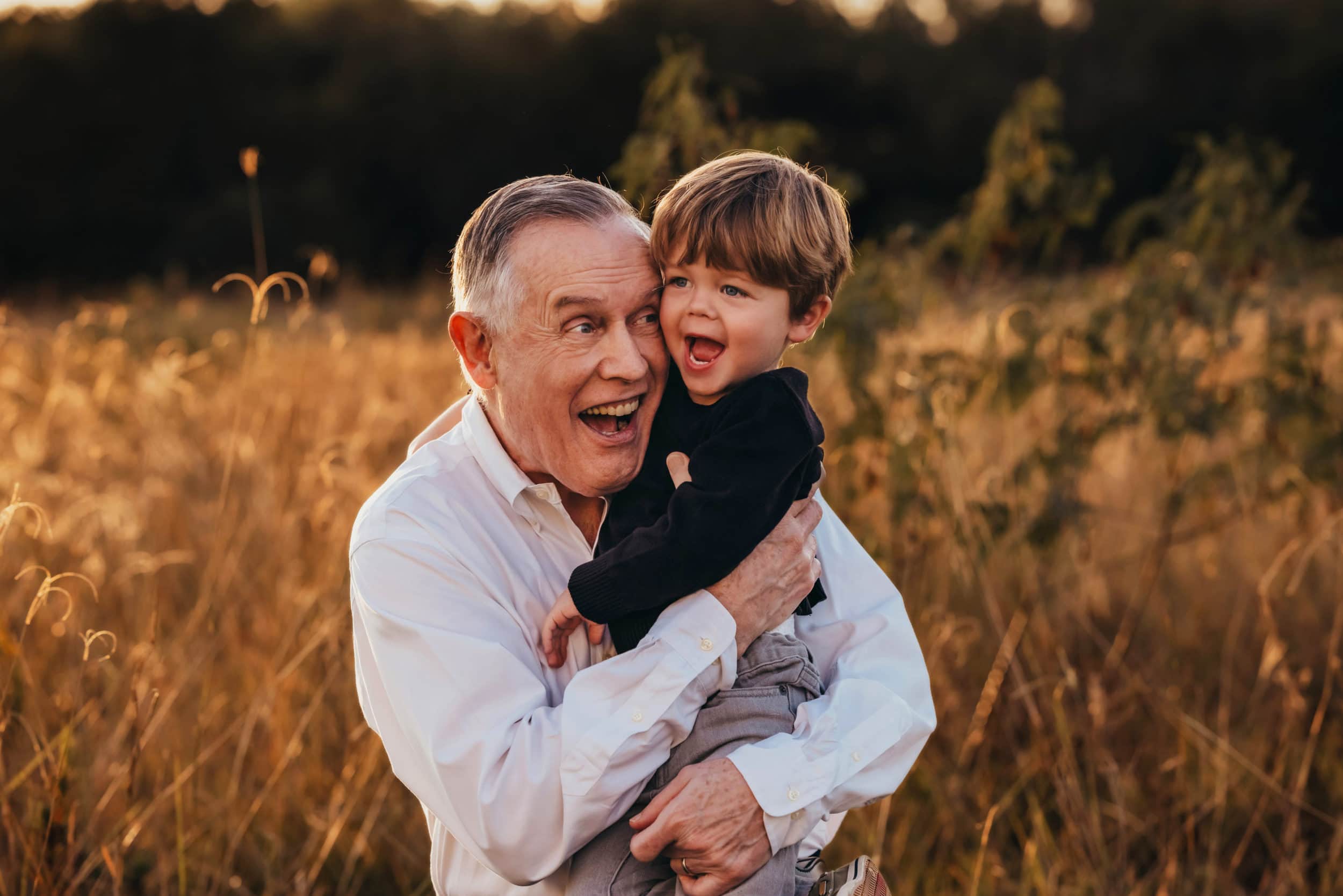 grandfather and grandson taking family photos in Houston
