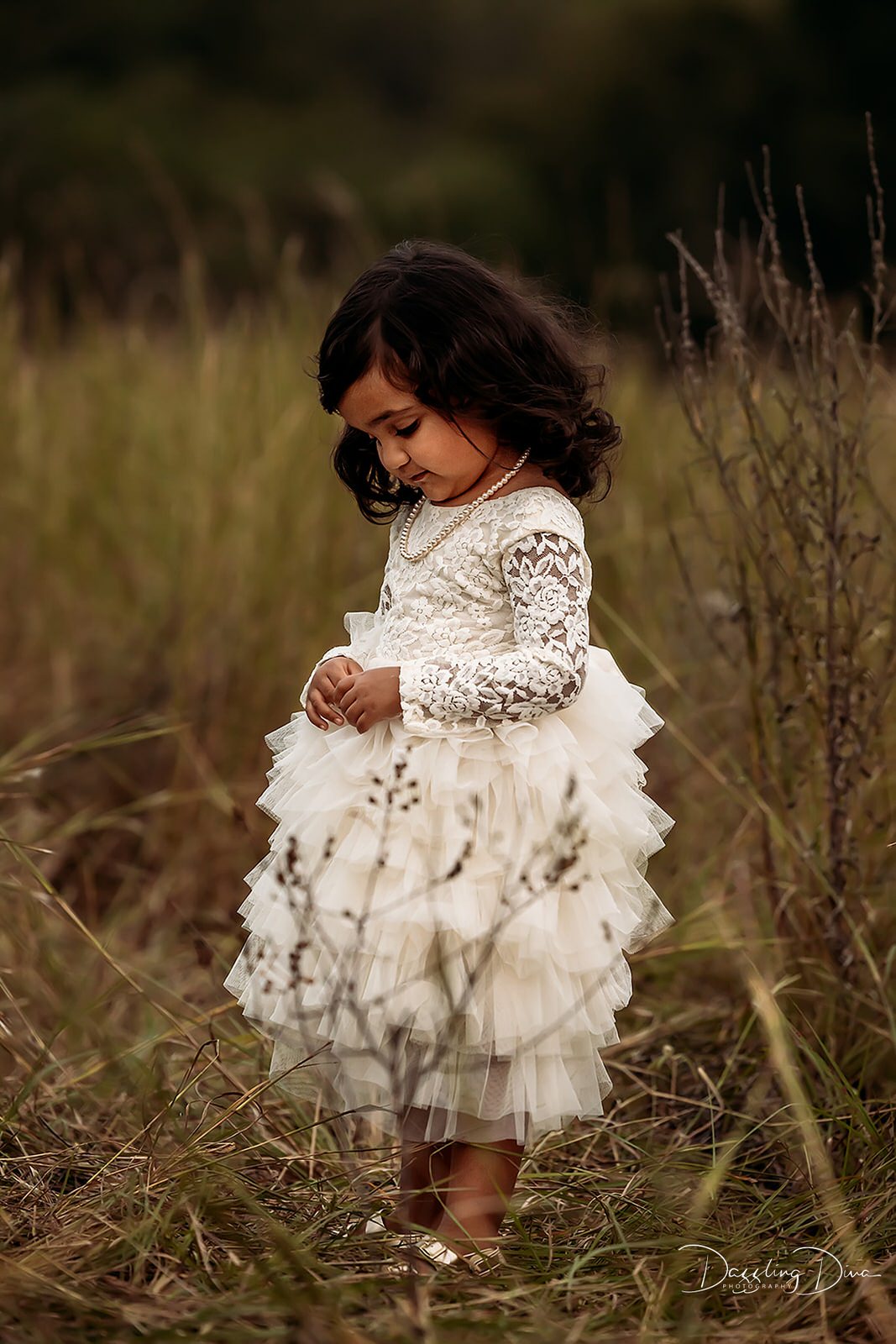 little girl in white dress taking family photos in Houston